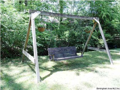 Relax on the double swing and listen to the birds 