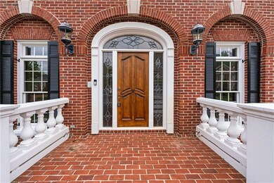Entrance to property with brick siding