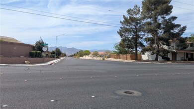 View of street with curbs, a mountain view, street