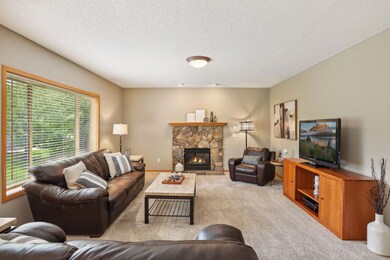 Stone gas fireplace with floating mantel