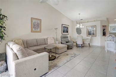 Living room featuring a notable chandelier, high v
