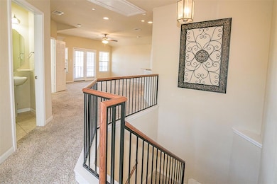 Hall with attic access, carpet flooring, recessed