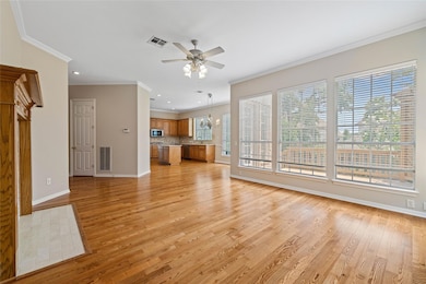 Unfurnished living room featuring visible vents, 