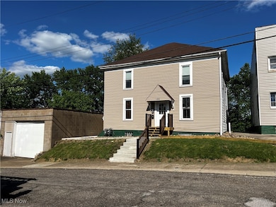 Traditional-style house with a front yard