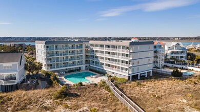 View of property with a water view