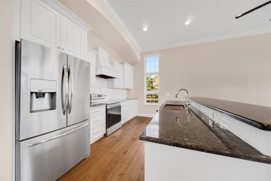 Stainless steel appliances.Windows in end units on
