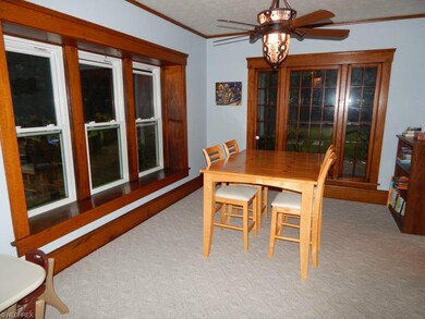 Dining Room-note beautiful wood trim around the wi
