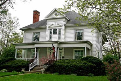 Notice the covered porch that spans the width of t