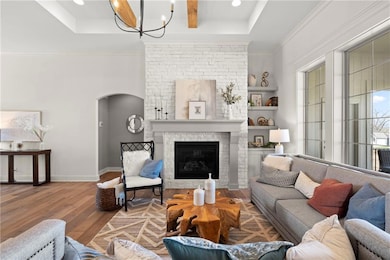 Great Room with vaulted ceilings - Photo from a previous model.