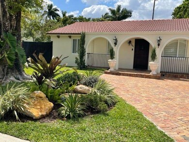 Front of the House with detail on landscape.