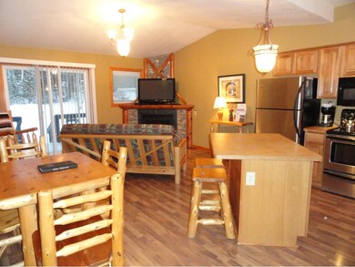 Open floor plan with vaulted ceilings.