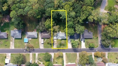 Aerial view of residential area featuring property boundaries highlighted