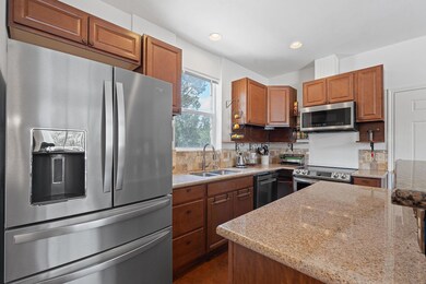 Kitchen with appliances with stainless steel fini