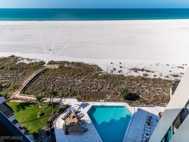 Aerial view featuring a water view and a beach vie