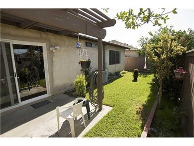 Charming backyard garden area. New Milgard windows being installed throughout. Back gate leads to pool.