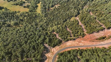 View of property location featuring a heavily wooded area