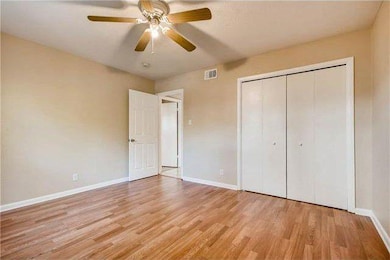 Unfurnished bedroom with light wood-type flooring