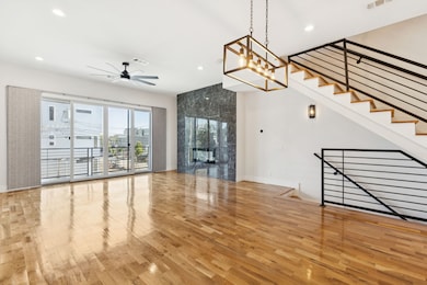 Unfurnished living room with light wood-style flooring, recessed lighting, a ceiling fan, and a fireplace