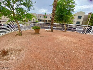 View of home's community with fence