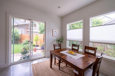 Dining area featuring finished concrete floors an