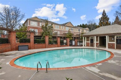 Community pool featuring fence and a residential v