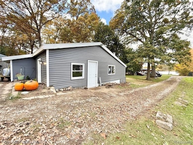 View of outdoor structure with oil tank