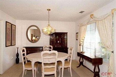 Dining area adjacent to living room and kitchen