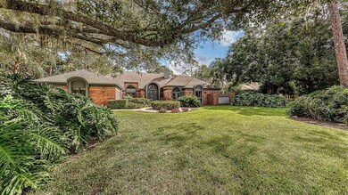 Surrounded by gracious oaks and lush foliage creat