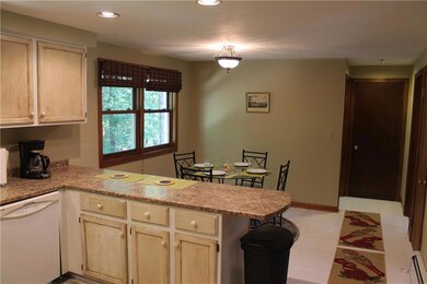 Eat-in kitchen with a breakfast bar.