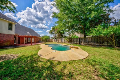 View of pool with a lawn and a patio area