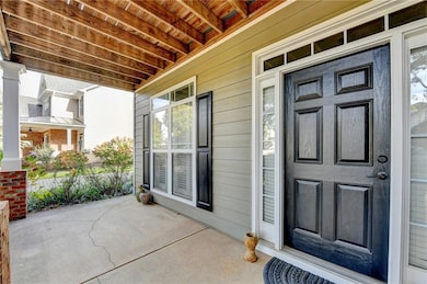 Property entrance featuring a porch