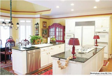 THIS DREAM KITCHEN HAS TWO LARGE GRANITE TOP ISLAN