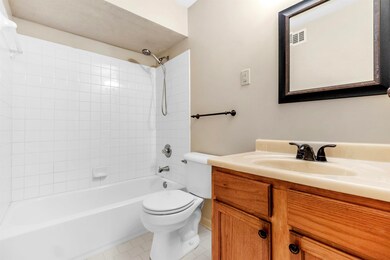 Bathroom with vanity, tile patterned flooring, vis