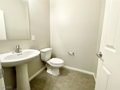 Bathroom with tile patterned floors, toilet, and b