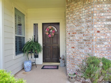 Charming front porch with room for your favorite plants and decor.