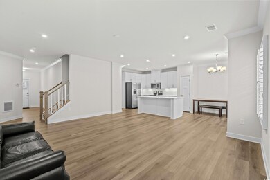 Living room with an inviting chandelier, ornamenta