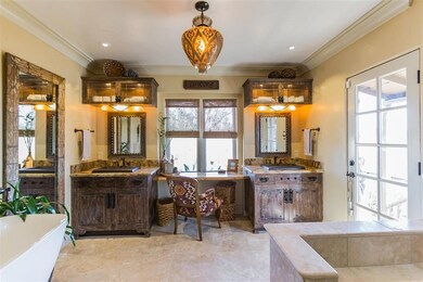 Relax in this custom designed Master bathroom. Dual sinks, rain shower, custom flooring, no detail has been spared. Custom Italian tile rug.