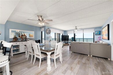Dining room with ceiling fan and a textured ceiling