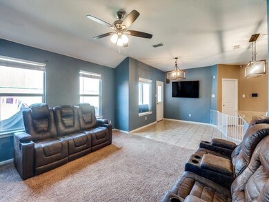Living room featuring light tile patterned floors 
