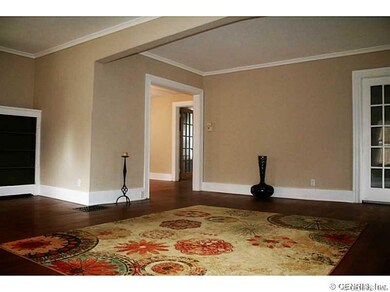 Living Room. The living room boasts a bold archway
