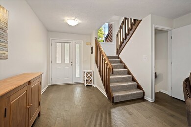 The Hardwood Floors And Neutral Decor Also Complim
