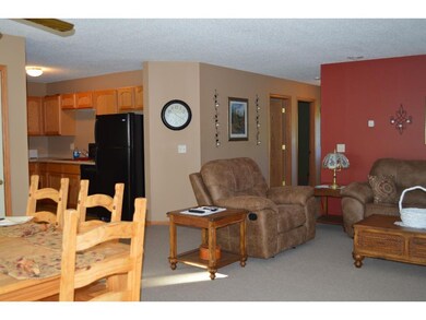 View of living room and kitchen.