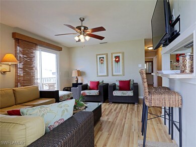 Living room with light wood-type flooring and ceil