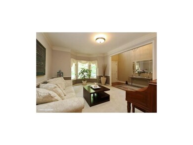Living or dining room.  Note bay window  on front 
