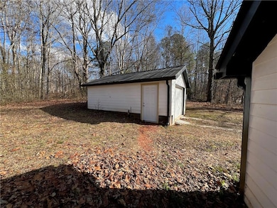 View of outbuilding with an outdoor structure
