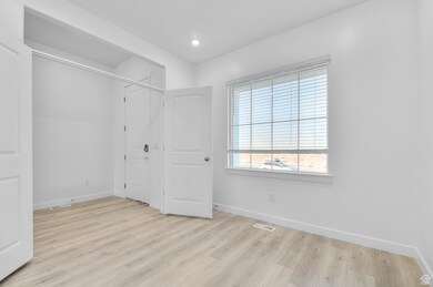 Unfurnished bedroom featuring light wood-style flooring and recessed lighting