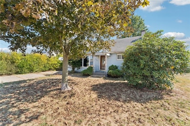 View of front of home featuring a chimney