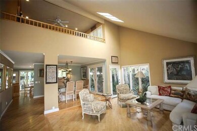 The downstairs features a gleaming wood floor and 