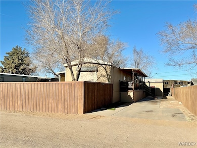Front of the property showing the mature trees and