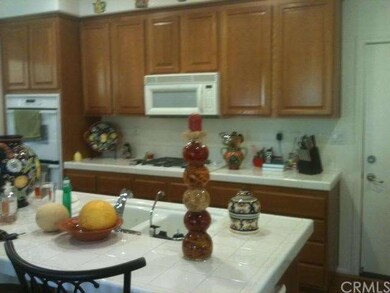 Kitchen with double oven, and door on right side i